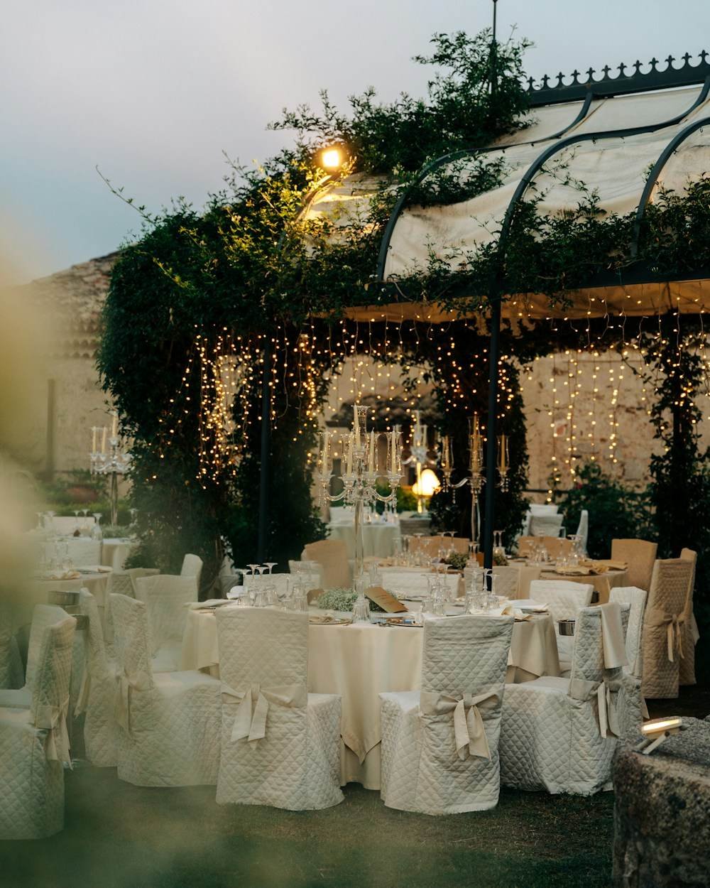 A room lit and draped for a reception