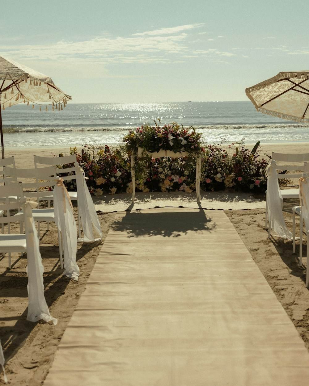 A ceremony aisle and chairs facing the sea