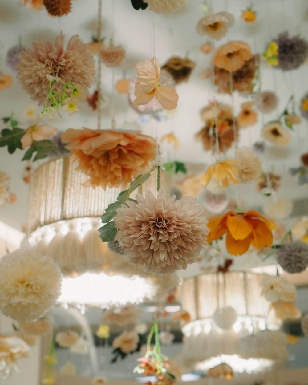 A hanging floral installation across a ceiling