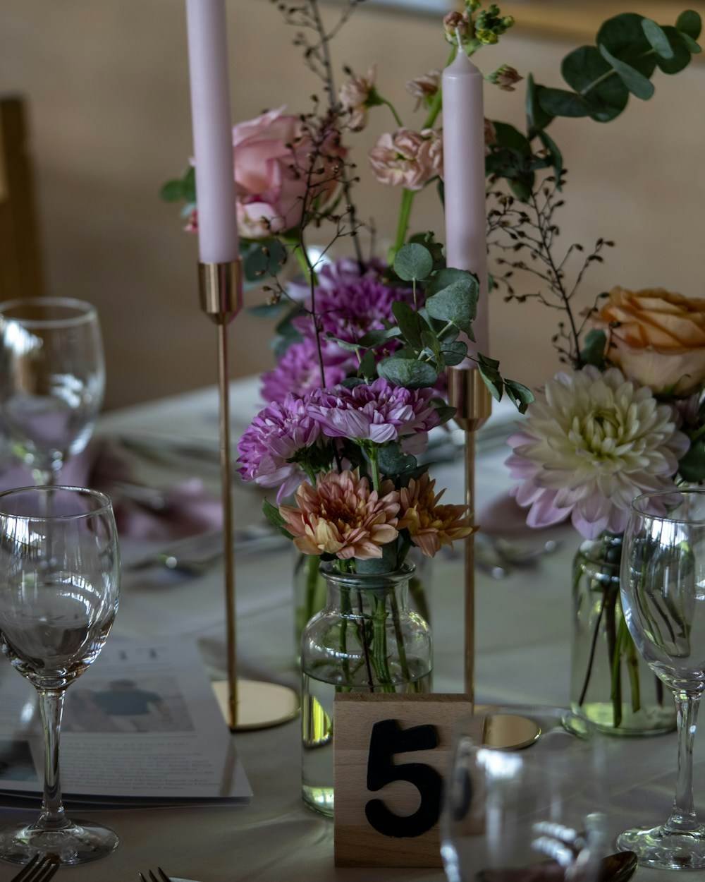 A table set with flowers and candles